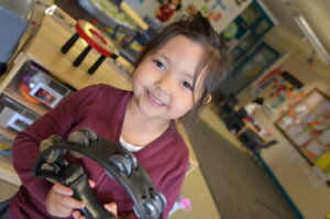 Child playing tambourine