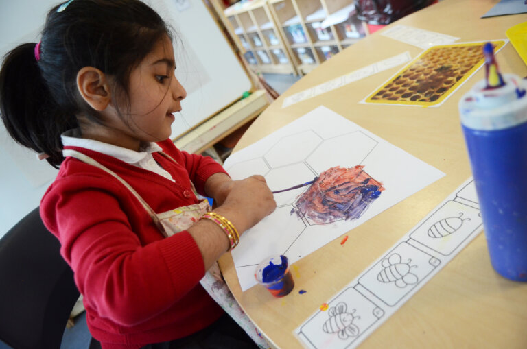 girl pupil painting EYFS