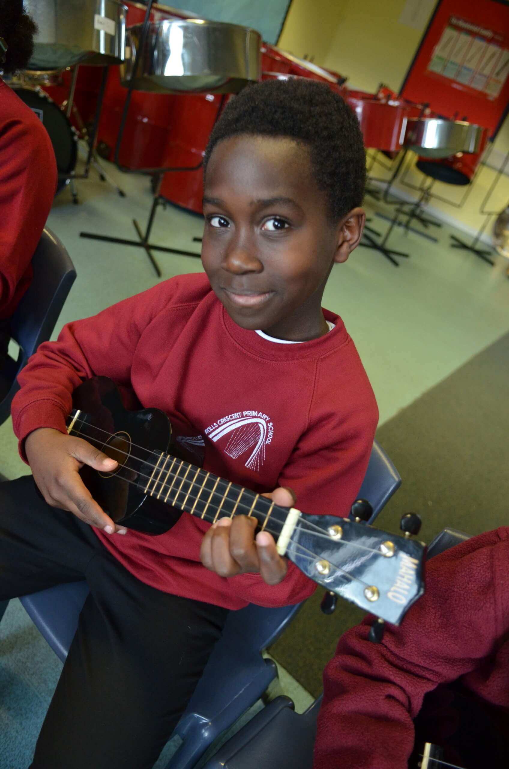 pupil playing ukulele