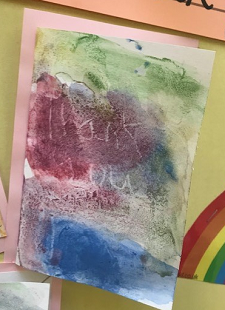 The colourful front page of a thank you card, painted by a child. 