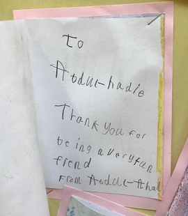 Inside the thank you card, a handwritten message from a child thanking their friend.
