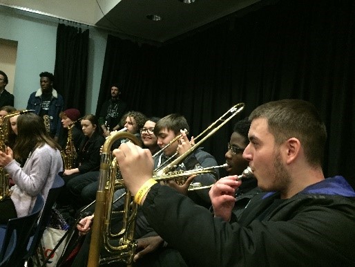 Students performing brass instruments. 